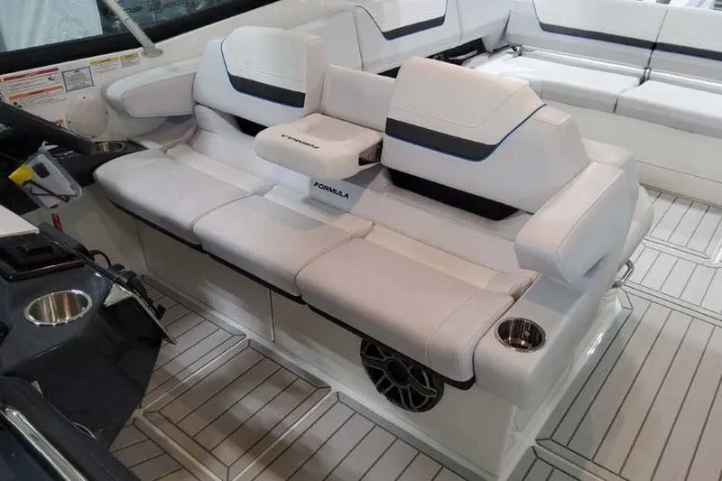 Slide: The Image of 2027 Formula 360 Crossover Bowrider OB interior with luxurious white seating and cup holders. - 35