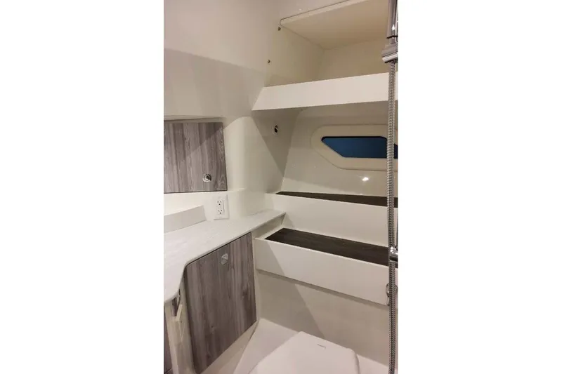 Slide: The Image of Interior of 2027 Formula 360 Crossover Bowrider OB, featuring modern cabinetry and sleek design. - 74