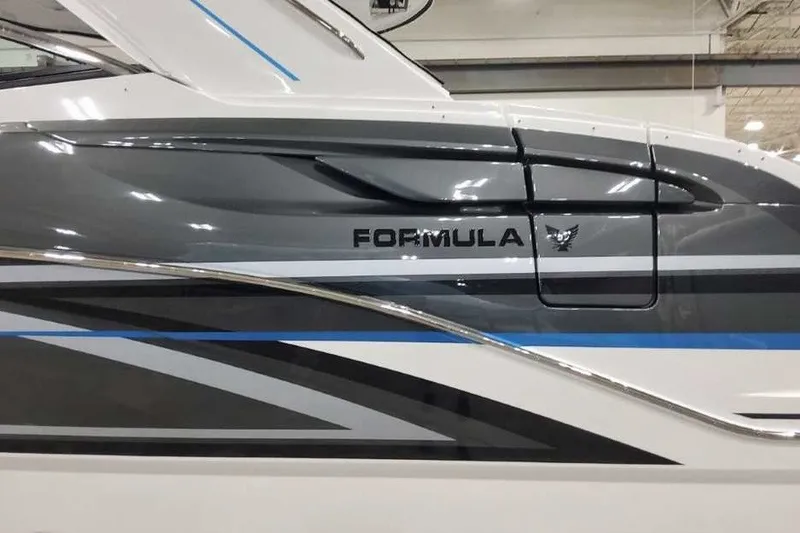 Slide: The Image of 2027 Formula 360 Crossover Bowrider OB, sleek gray and white design, side view. - 9