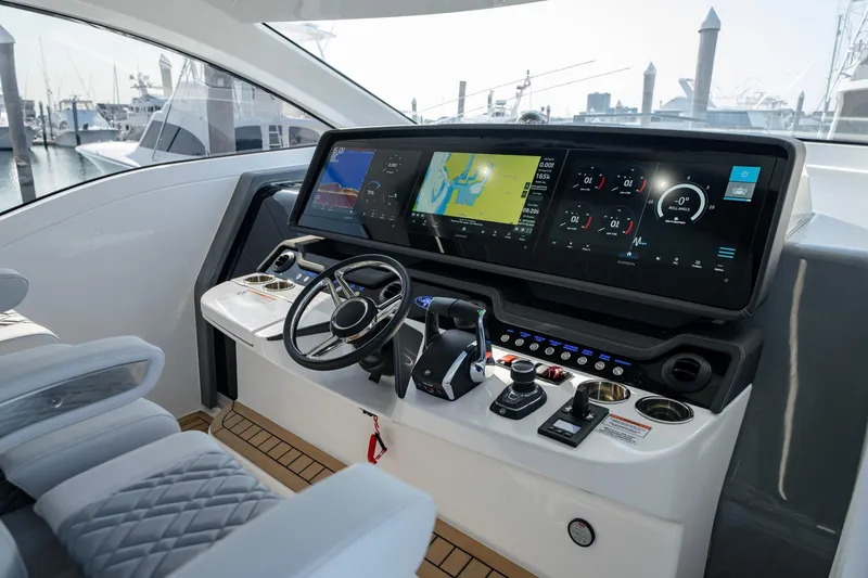 Slide: The Image of 2026 Valhalla V-55 Sport Yacht helm with advanced navigation displays and controls. - 5