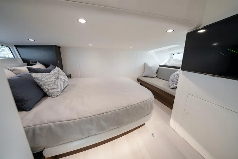 Slide: The Image of Luxurious cabin interior of 2026 Valhalla V-55 Sport Yacht with modern bedding and TV. - 7