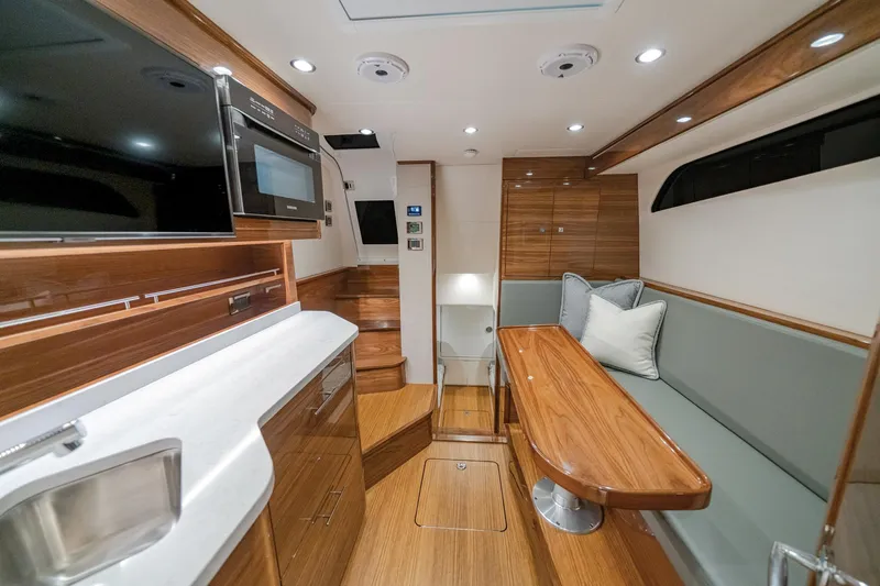 Slide: The Image of Luxurious interior of 2026 Valhalla Boatworks V-55 with modern kitchen and seating area. - 5