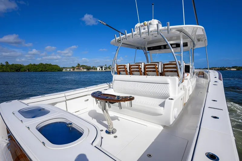 Slide: The Image of 2026 Valhalla Boatworks V-46 on water, featuring spacious deck and seating. - 17