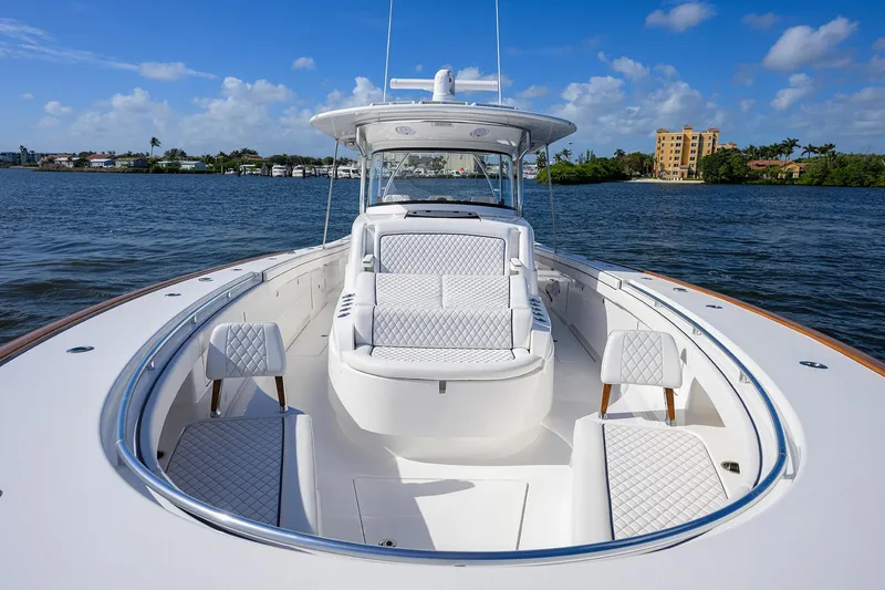 Slide: The Image of 2026 Valhalla Boatworks V-46 luxury yacht on calm waters, featuring elegant seating and sleek design. - 11