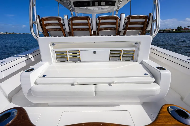 Slide: The Image of 2026 Valhalla Boatworks V-46 interior with seating and storage, on a sunny day. - 18