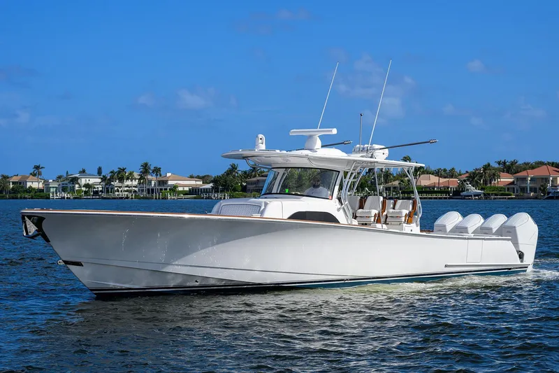 Slide: The Image of 2026 Valhalla Boatworks V-46 cruising on a sunny day, showcasing sleek design and powerful engines. - 1