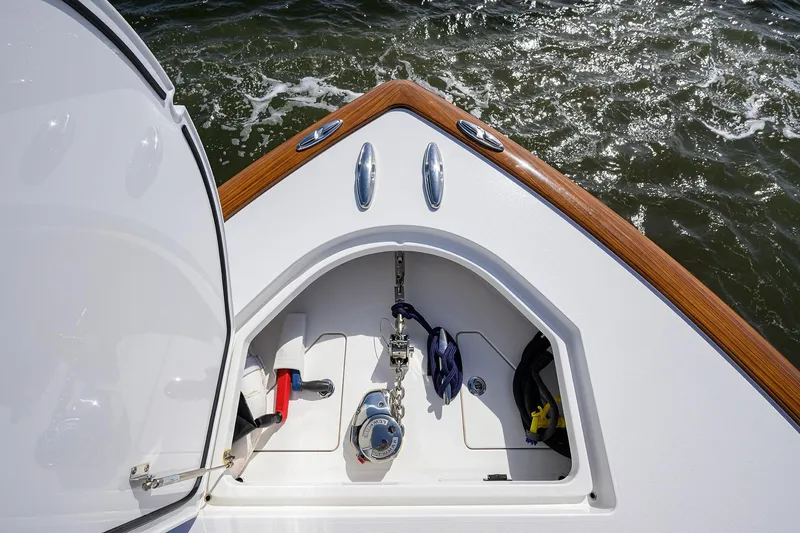 Slide: The Image of 2026 Valhalla Boatworks V-46 anchor compartment with teak accents on open water. - 10