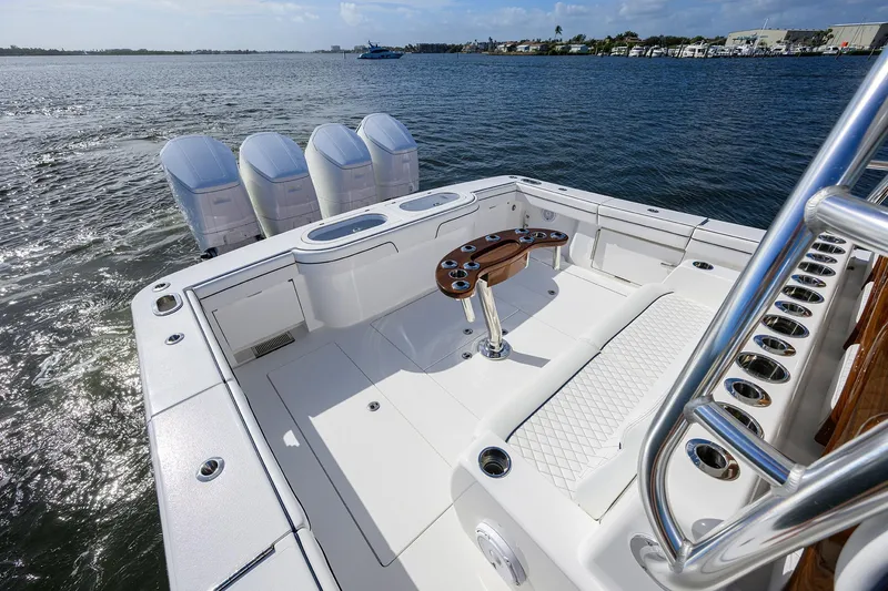 Slide: The Image of 2026 Valhalla Boatworks V-46 with spacious deck and multiple outboard engines on the water. - 16