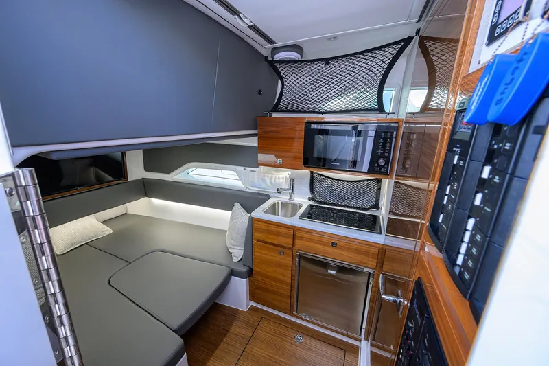 Slide: The Image of Luxurious interior of 2026 Valhalla Boatworks V-46 with modern kitchen and cozy seating area. - 12