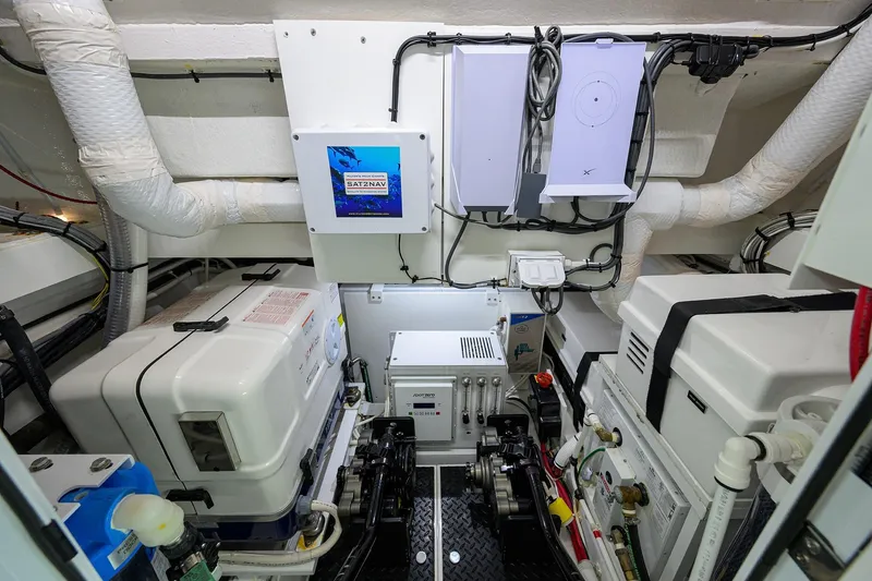 Slide: The Image of Engine room of 2026 Valhalla Boatworks V-46, showcasing advanced equipment and wiring. - 23