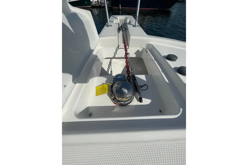 Slide: The Image of 2007 Luhrs 31 Open boat anchor chain and winch on deck. - 24