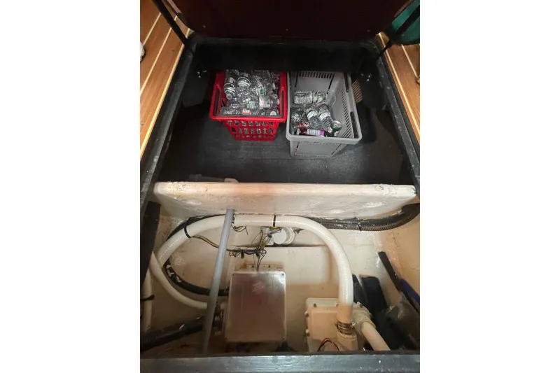 Slide: The Image of Bilge area of 2007 Luhrs 31 Open boat with storage baskets and plumbing. - 15