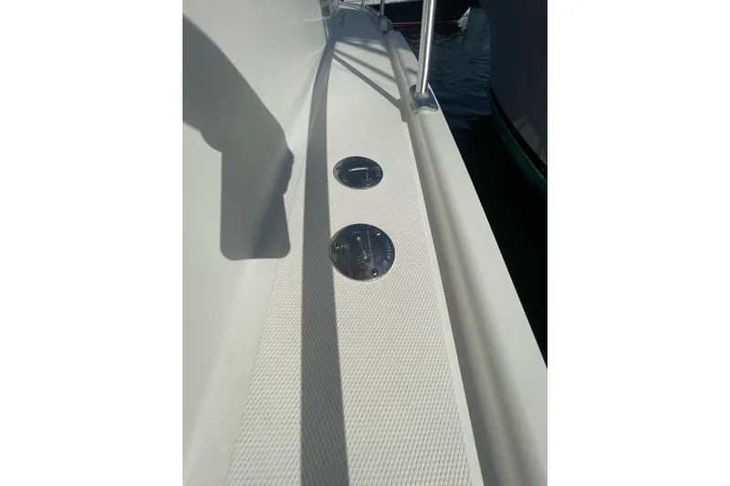 Slide: The Image of 2007 Luhrs 31 Open boat deck with metal fixtures and textured surface. - 23