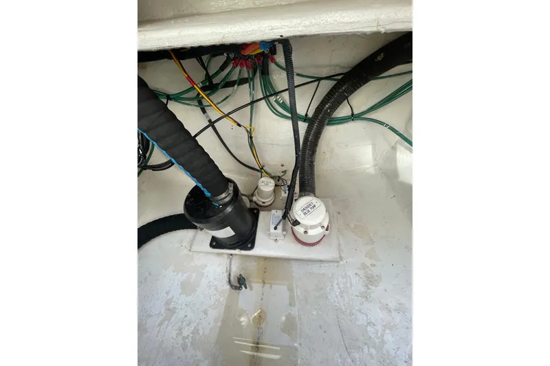 Slide: The Image of Engine compartment of a 2007 Luhrs 31 Open boat, showing wiring and components. - 18