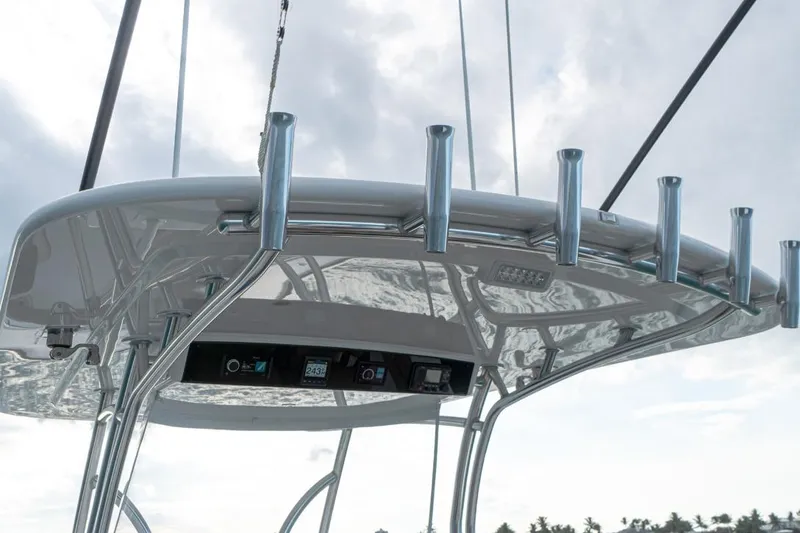 Slide: The Image of 2026 Valhalla Boatworks V-41 T-top with rod holders and electronic displays. - 7