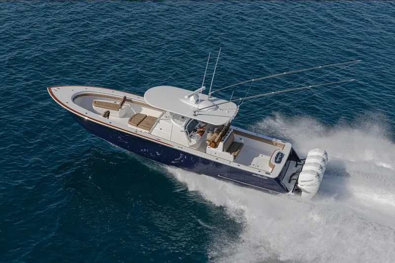 Slide: The Image of 2026 Valhalla Boatworks V-41 cruising on open water, showcasing sleek design and powerful engines. - 2