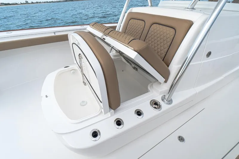 Slide: The Image of 2026 Valhalla Boatworks V-41 with open storage compartment and cushioned seating. - 10