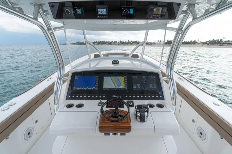 Slide: The Image of 2026 Valhalla Boatworks V-41 helm with advanced navigation displays on open water. - 5