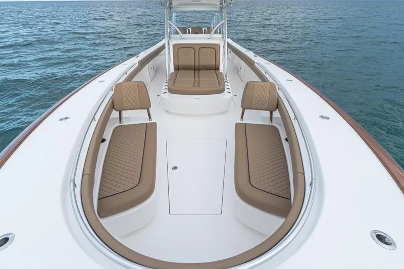 Slide: The Image of 2026 Valhalla Boatworks V-41 with luxurious seating on calm ocean waters. - 9