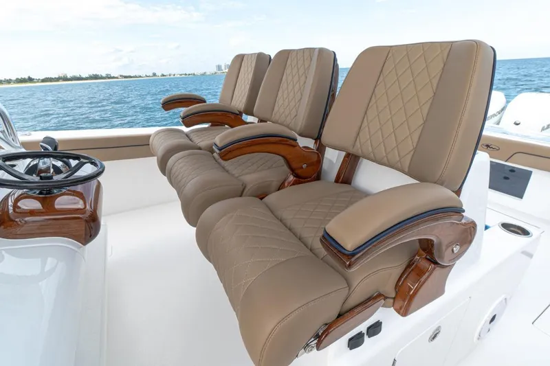 Slide: The Image of Luxurious seating on 2026 Valhalla Boatworks V-41, featuring elegant tan upholstery and wooden accents. - 6