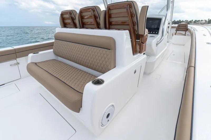 Slide: The Image of 2026 Valhalla Boatworks V-41 interior with luxurious seating and ocean view. - 13