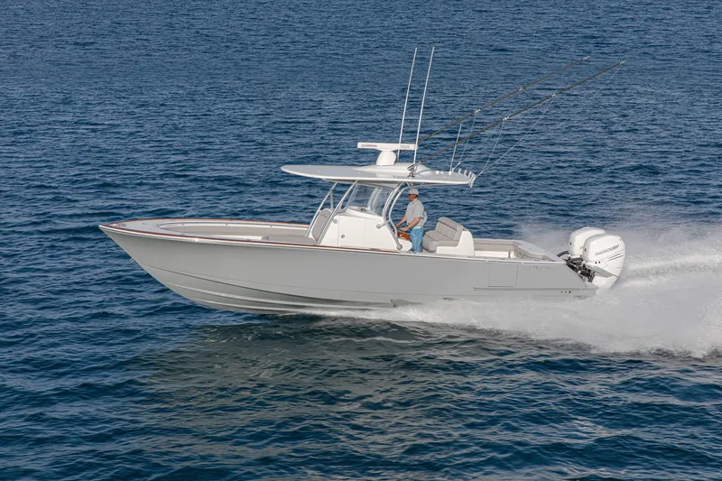 Slide: The Image of 2027 Valhalla Boatworks V-33 cruising on open water, side view. - 2