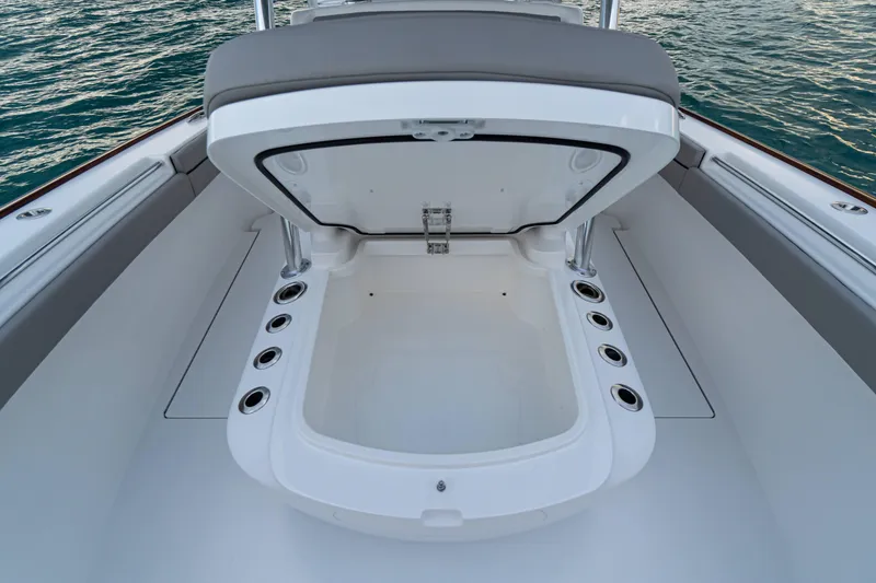 Slide: The Image of Open storage compartment on 2027 Valhalla Boatworks V-33, with ocean backdrop. - 12