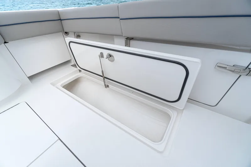 Slide: The Image of Open storage compartment on 2027 Valhalla Boatworks V-33, showcasing sleek design and functionality. - 18