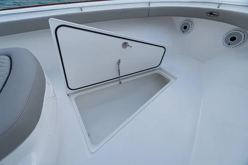 Slide: The Image of 2027 Valhalla Boatworks V-33 storage compartment with open hatch and speakers. - 11