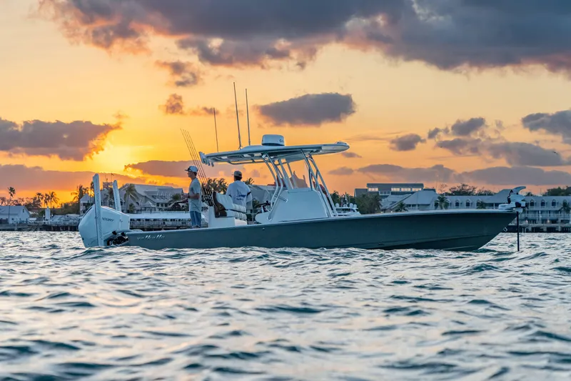 Slide: The Image of 2027 Valhalla Boatworks V-28 Bay at sunset, cruising on calm waters. - 3