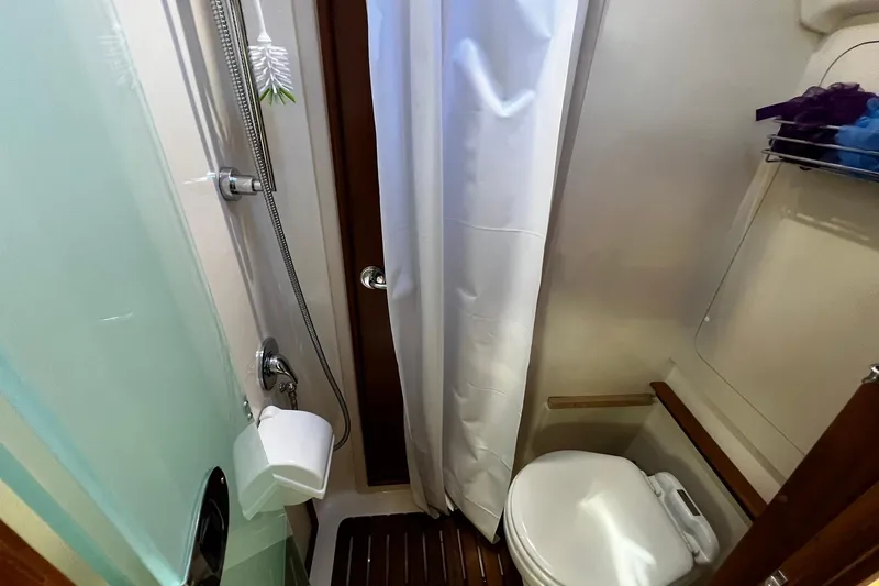 Slide: The Image of Compact bathroom in a 2015 Hunter 37 yacht with shower and toilet. - 35