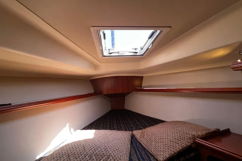 Slide: The Image of Cozy cabin interior of 2015 Hunter 37 sailboat with skylight and cushions. - 50