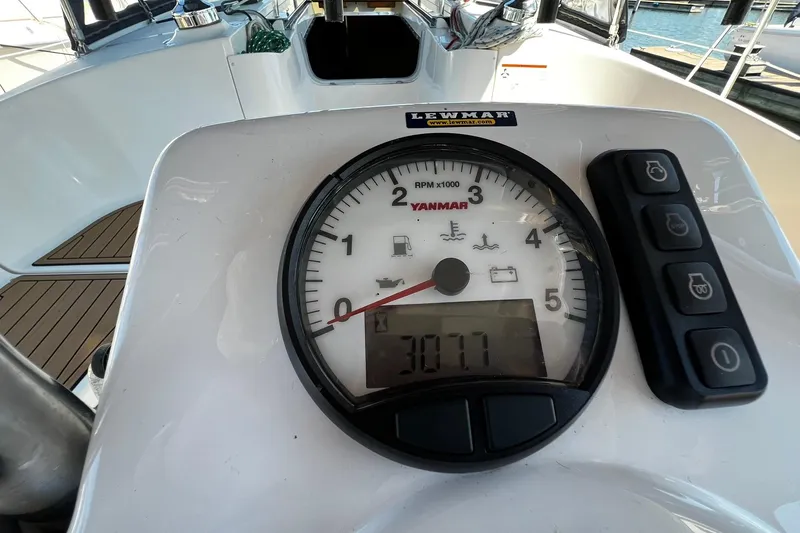 Slide: The Image of Yanmar RPM gauge on 2015 Hunter 37 sailboat dashboard, showing 3077 hours. - 9