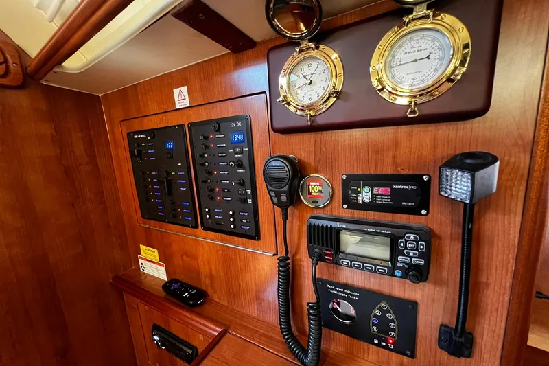 Slide: The Image of Control panel of a 2015 Hunter 37 yacht with navigation and communication equipment. - 40