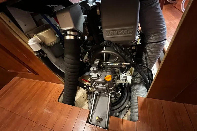 Slide: The Image of Engine compartment of a 2015 Hunter 37 sailboat, featuring a Yanmar engine. - 55