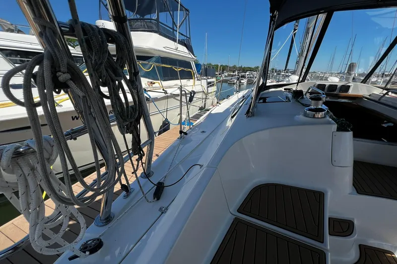 Slide: The Image of Hunter 37 sailboat from 2015 docked at a marina, showcasing deck and rigging. - 4