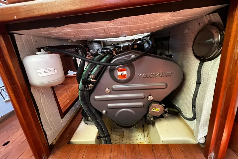 Slide: The Image of Engine compartment of a 2015 Hunter 37 sailboat featuring a Yanmar engine. - 53
