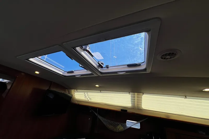 Slide: The Image of Interior view of a 2015 Hunter 37 sailboat with open skylights. - 48