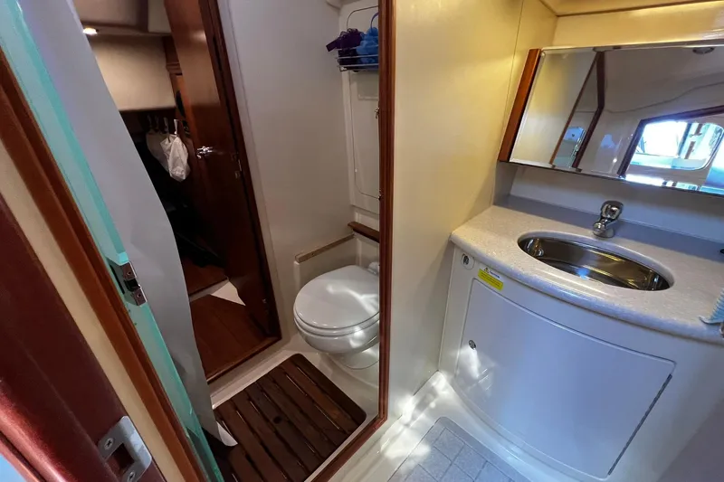 Slide: The Image of Bathroom interior of a 2015 Hunter 37 yacht, featuring a sink and toilet. - 32