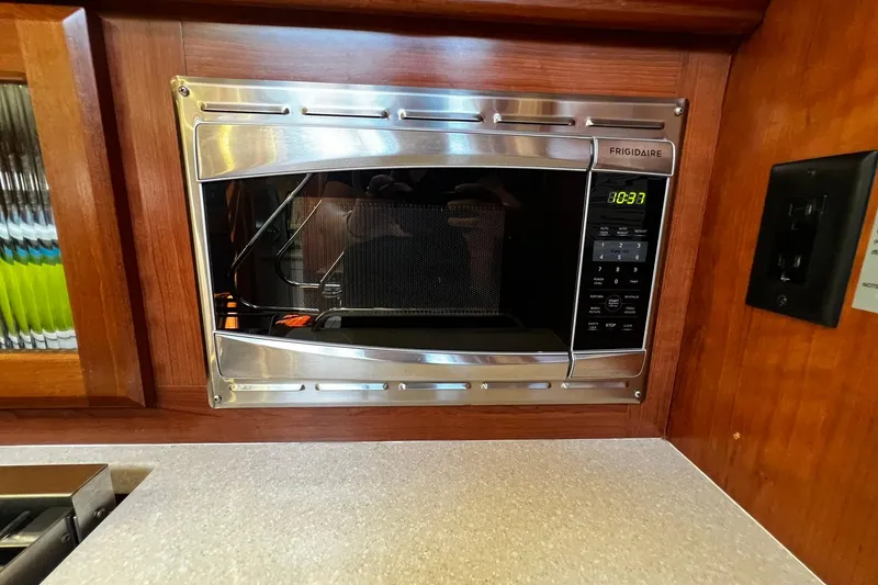 Slide: The Image of Built-in Frigidaire microwave in 2015 Hunter 37 yacht kitchen interior. - 24