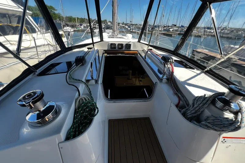 Slide: The Image of Cockpit view of a 2015 Hunter 37 sailboat docked at a marina. - 7