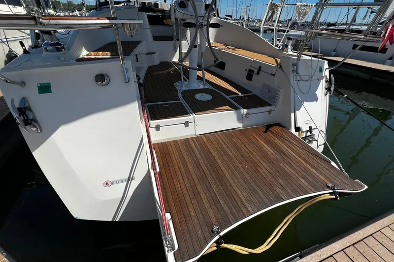 Slide: The Image of Hunter 37 sailboat, 2015 model, featuring a spacious wooden deck and modern design. - 2