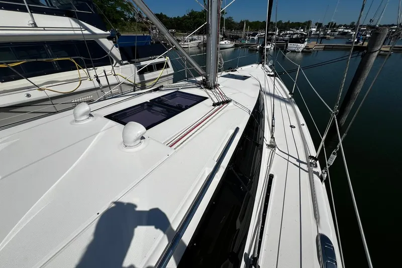 Slide: The Image of Hunter 37 sailboat deck, 2015 model, docked at marina with clear skies. - 13