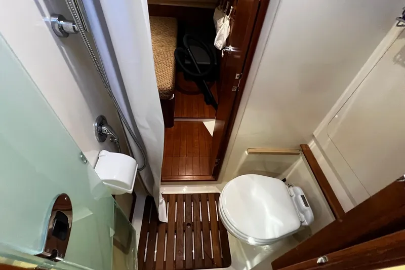 Slide: The Image of Compact bathroom in 2015 Hunter 37 yacht with wooden flooring and modern fixtures. - 34