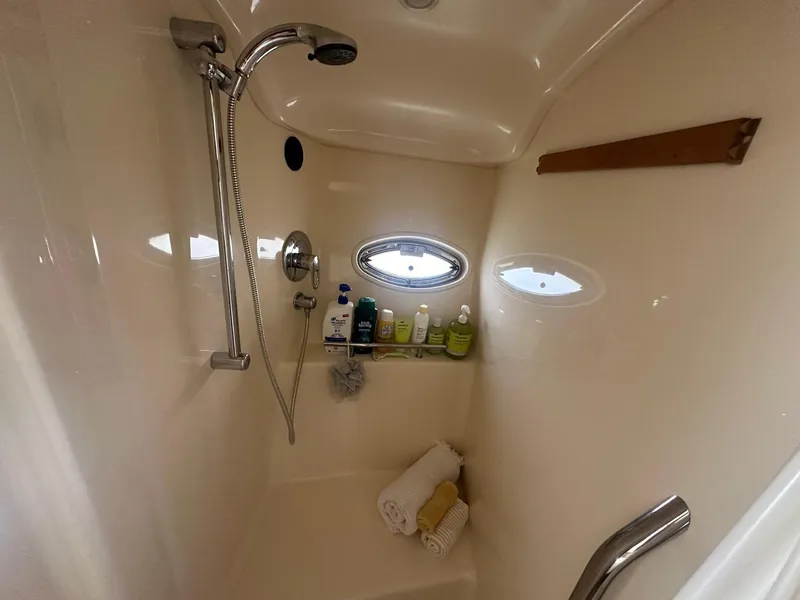 Slide: The Image of The shower in the 2006 Sea Ray 380 Sundancer is compact and well-equipped. - 13