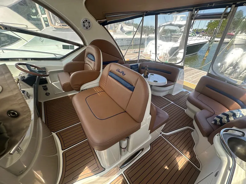 Slide: The Image of The image shows the cockpit of a 2006 Sea Ray 380 Sundancer with elegant leather seating. - 24
