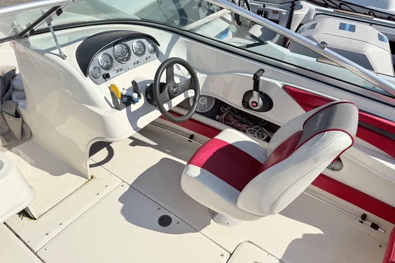 Slide: The Image of Interior of 2006 Sea Ray 210 Bow Rider boat with steering wheel and dashboard. - 7