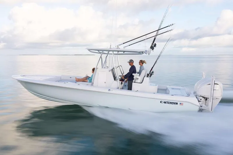 The Image of Manufacturer Provided Image: 2026 Contender 29 Bay boat cruising on calm water with fishing rods. - 1