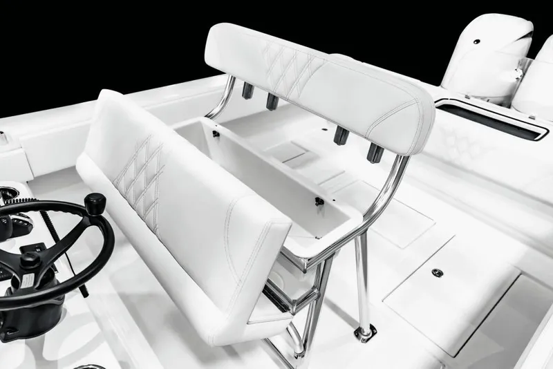 Slide: The Image of Manufacturer Provided Image: 2026 Contender 29 Bay boat interior with white seating and steering wheel. - 7