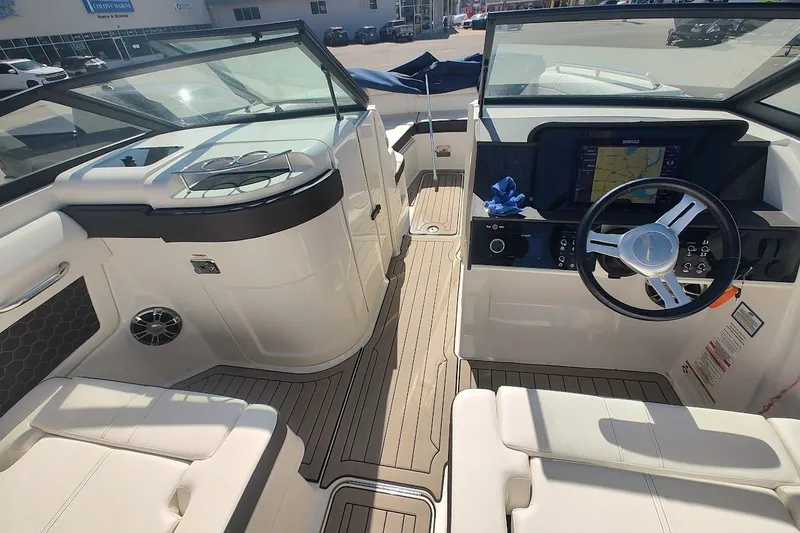 Slide: The Image of Interior view of 2021 Sea Ray SDX 270 Outboard boat with modern dashboard and seating. - 18